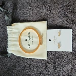 Kate Spade matching Bow Bracelet and Earrings with draw string dust bag.